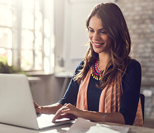 woman reading on her computer